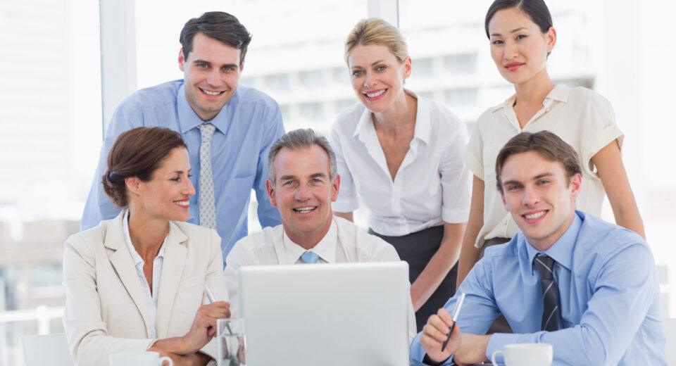 business colleagues with laptop desk scaled