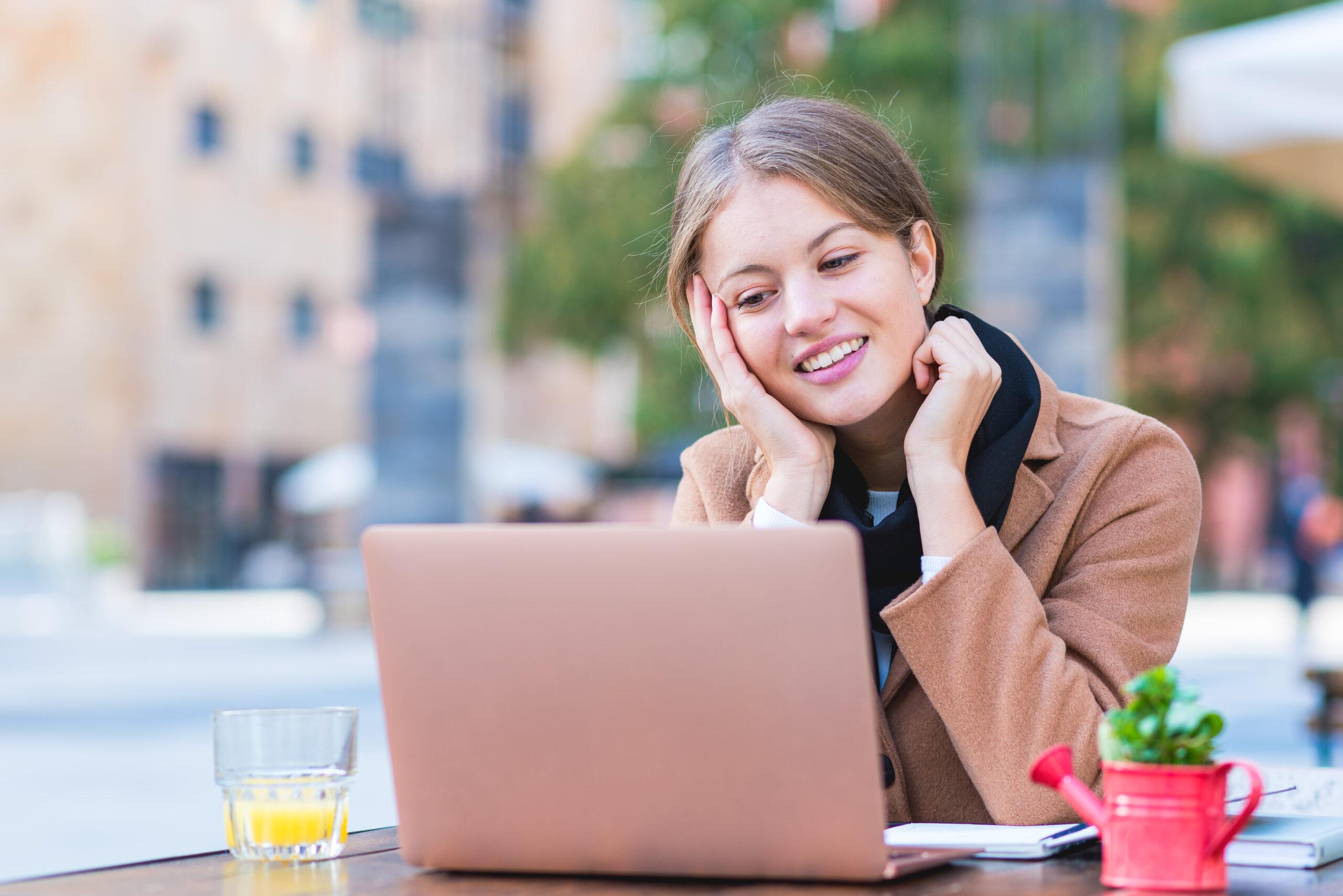 portrait young business woman working open air female university student usung laptop learning communicating studying scaled